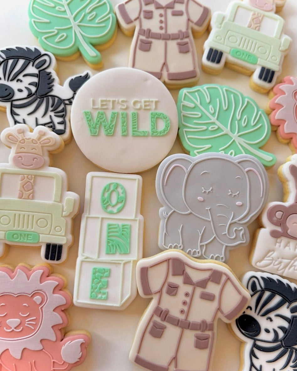 lets get wild cookie stamp cookie cutter stampandimpess elephant safari one monkey monstera leaf zebra jeep giraffe