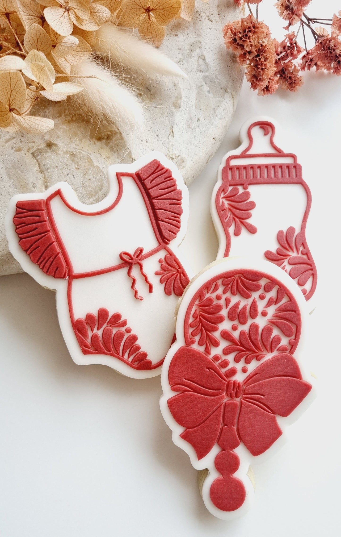 cielito lindo baby bottle rattle with bow baby girl onesie romper frill pattern floral baby shower cookie stamp cookie cutter stampandimpress