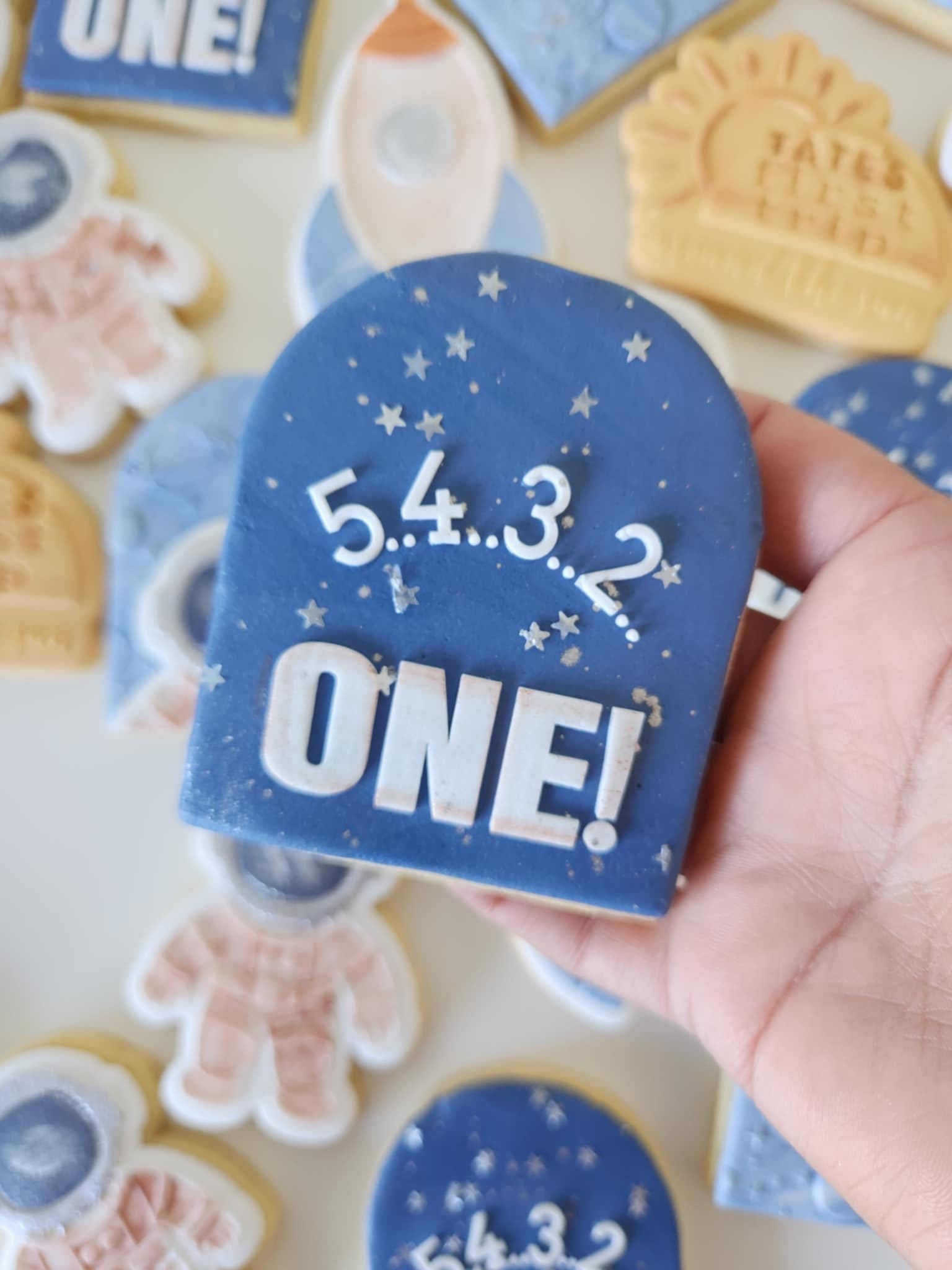 5 4 3 2 one astronaut rocket galaxy saturn planet first trip around the sun stars moon sun cookie stamp cookie cutter stampandimpress fondant debosser embosser